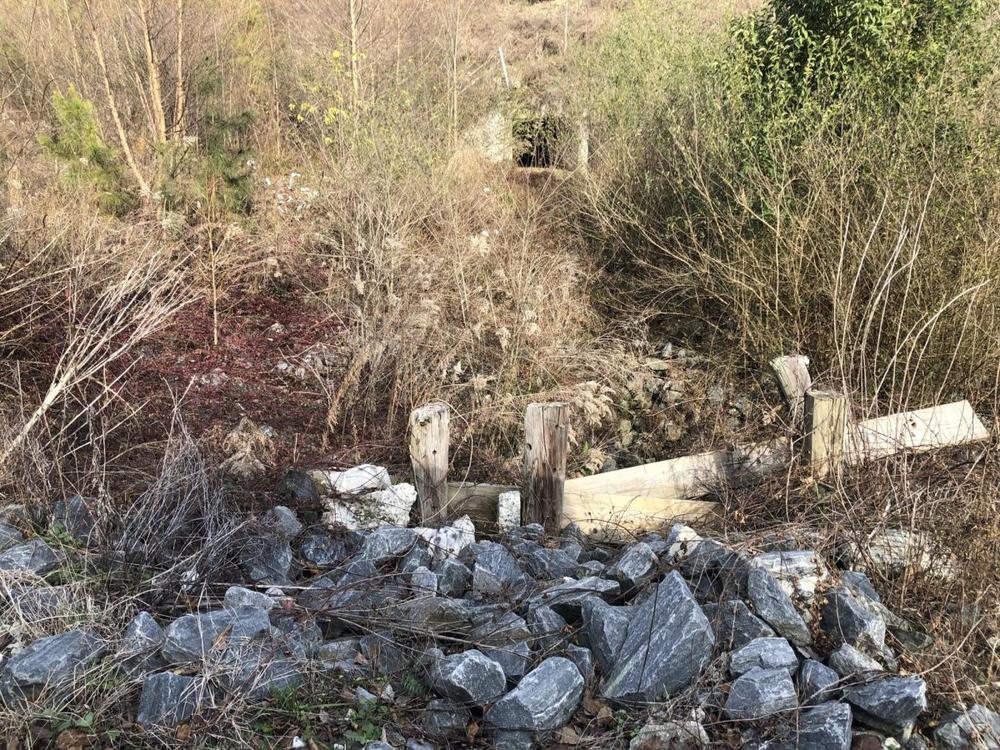During heavy rains, torrents of water from a 54-inch main rush through a culvert underneath the Sardis Church Road Extension but smaller pipes on either end keep the water from draining adequately.