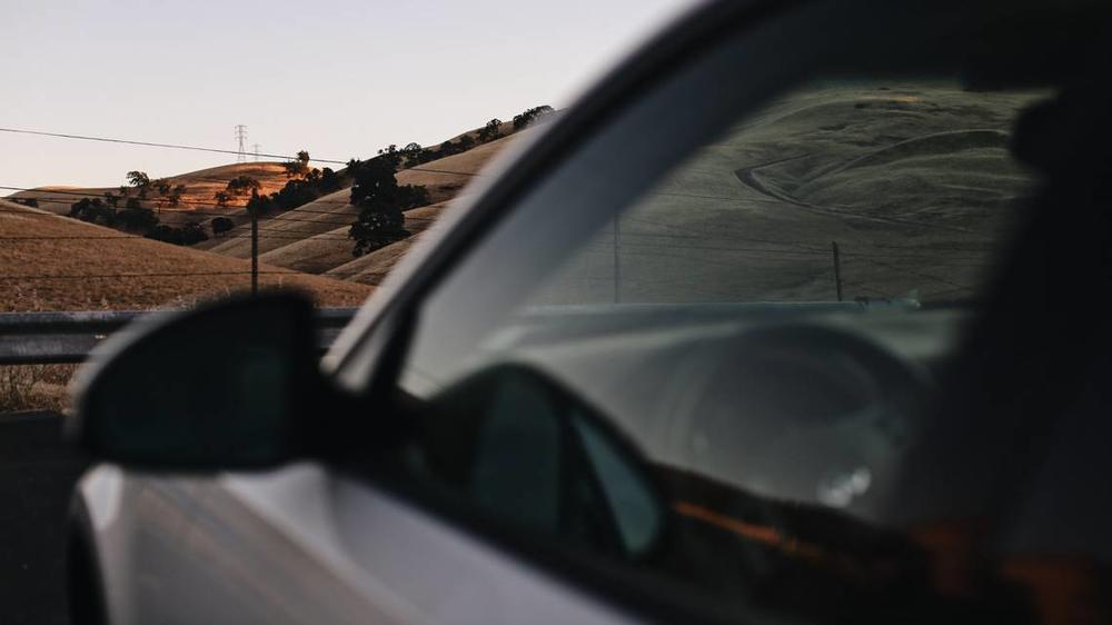 A dark-tinted car window 