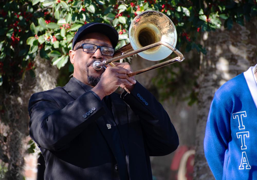 Windsor Forest High School Band Director Steven Johnson plays Amazing Grace to close out the memorial for Moffett at the school Thursday.