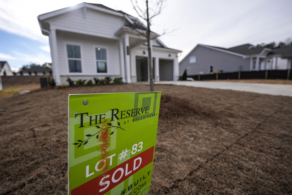 A sign announces a new home has been sold on Tuesday, Jan. 16, 2024, in Kennesaw, Ga. The Georgia House on Feb. 20, 2024 passed a bill that could allow local school districts to reduce property tax rates and continue to receive state aid (AP Photo/Mike Stewart)