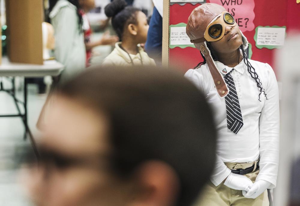 Student Jaleigh Rhodes in between recitations of the life story of Bessie Coleman, the first Black woman in the nation to be a licensed pilot. 
