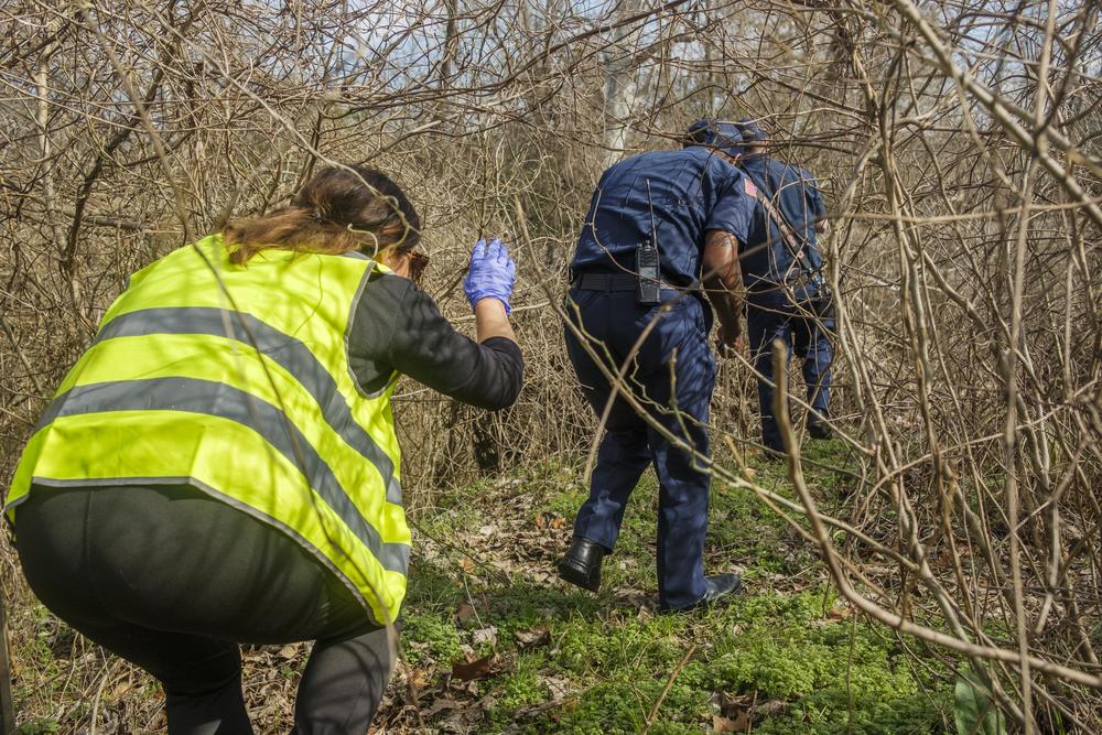 Heather Sims follows firefighters to a homeless encampment wedged up against Macon's interstate bypass. 