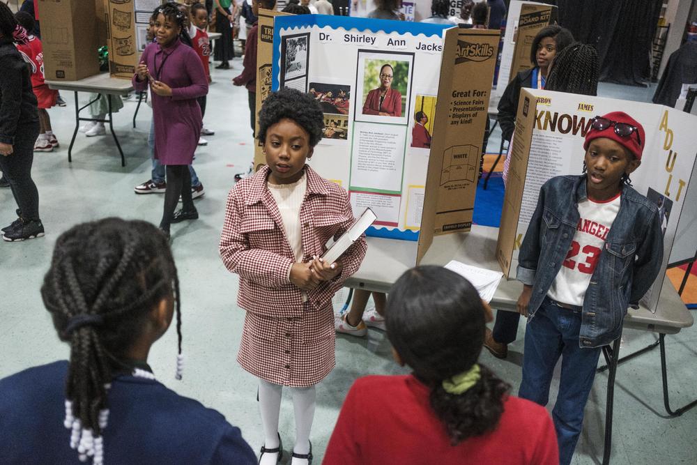 Harmony Johnson, a fourth grade student at Macon's Vineville Academy for the Arts, shares the life story of physicist Dr. Shirley Ann Jackson during the living Black history museum at the school recently. 