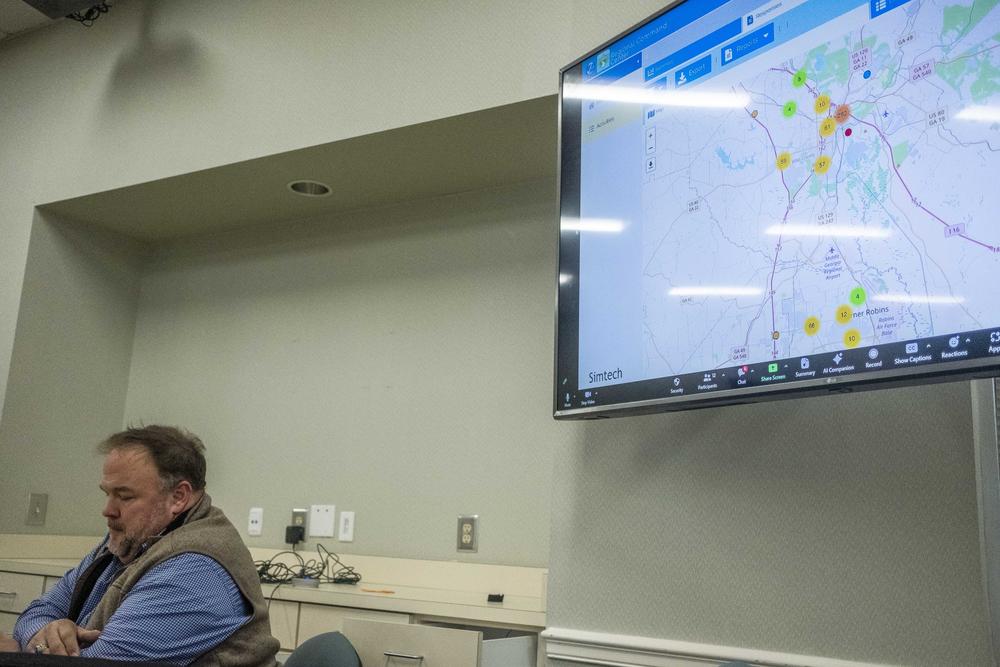 The United Way's Jake Hall presents the first rough numbers in Macon's 2024 homeless census to members of the local homeless coalition a few weeks after the close of the census. 