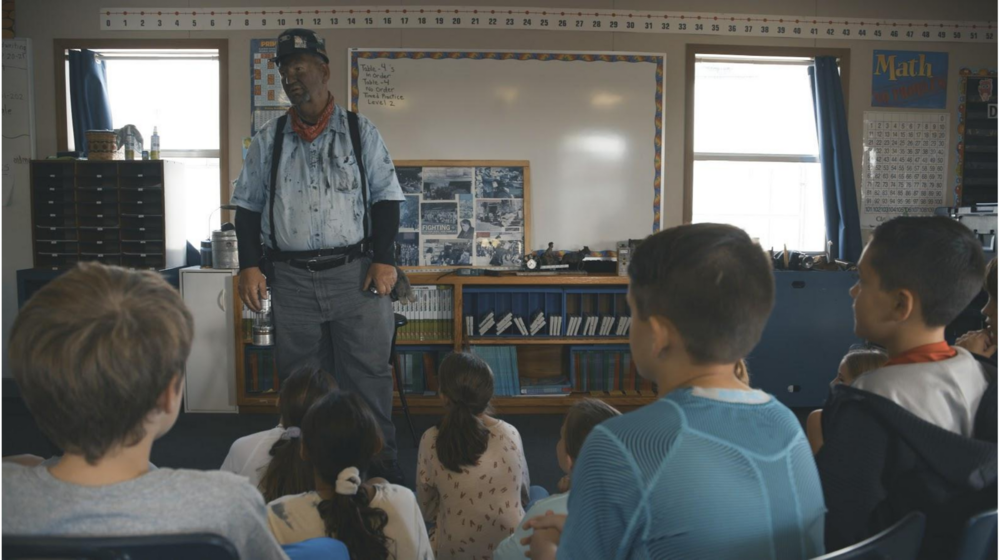 A former coal miner speaks to an elementary school class in "King Coal"