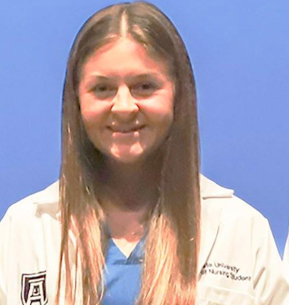 22-year-old nursing student Laken Hope Riley is shown wearing scrubs from Augusta University School of Nursing.