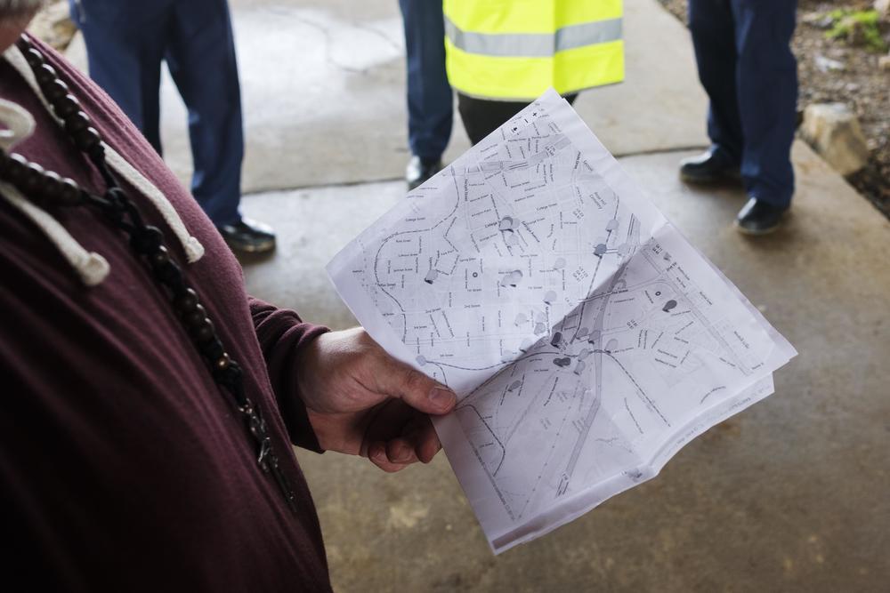 Jake Hall holds a paper copy of the map he and census volunteers used to inform their 2024 count of unsheltered homeless in Macon. 