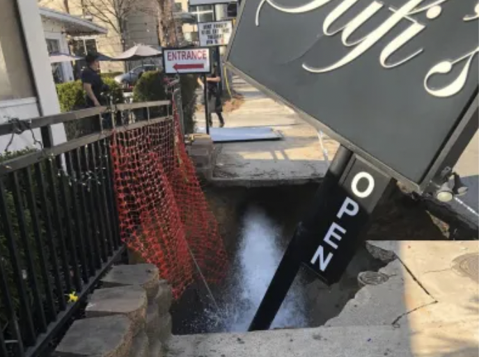 The Sufi’s Kitchen sign in front of the Peachtree Road Persian restaurant collapsed into a sinkhole on Monday. This photo was posted on Facebook by R. Thomas Deluxe Grille, which is located next door. 