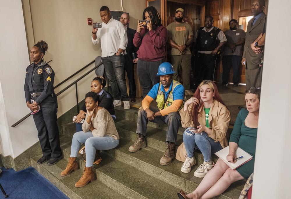 An over-capacity Bibb County Commission Chamber meant some who came to the first forum of candidates for Sheriff had to sit in the entrance to the room. 