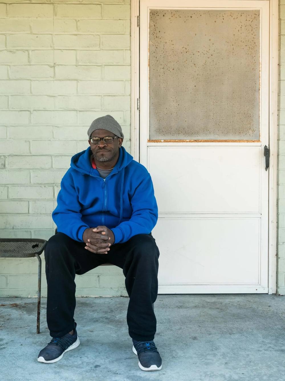 Cedrick Muse sits outside of his uncle’s home, Jan. 4, 2024, in Brunswick. Muse has been selected as one of the first residents of Hand in Hand.