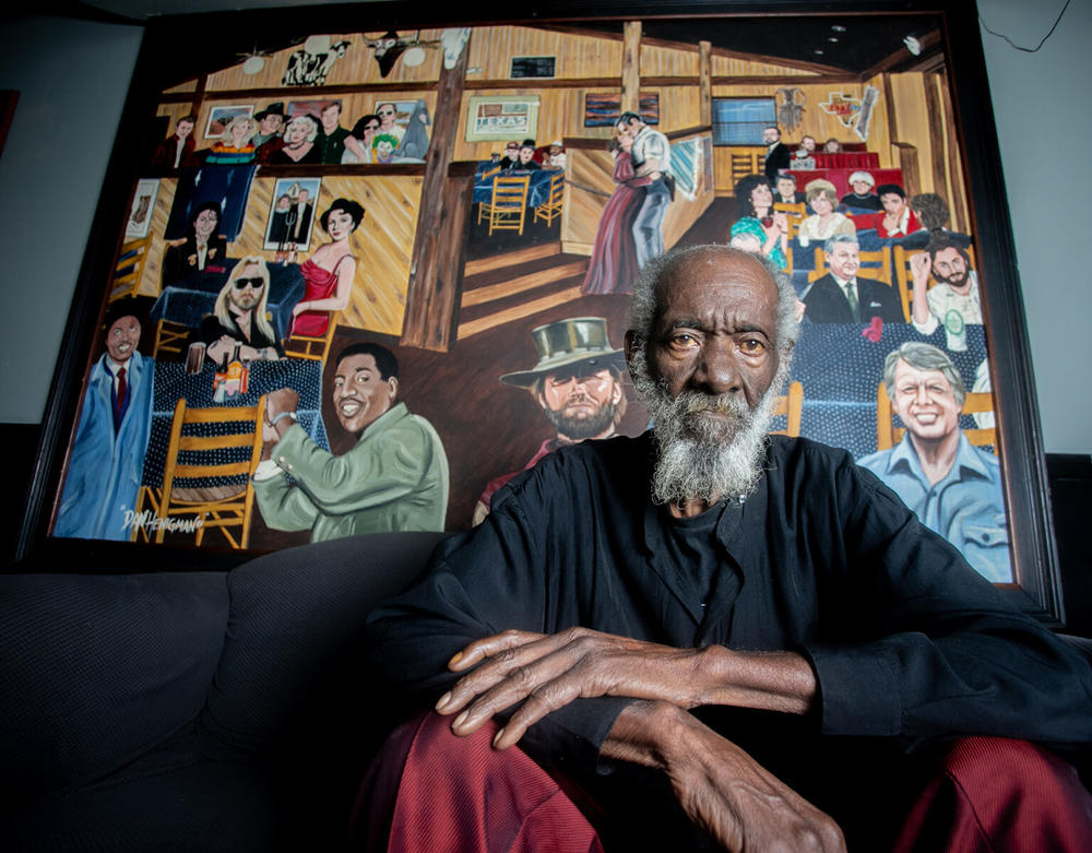 Robert Lee Coleman in front of mural in Macon