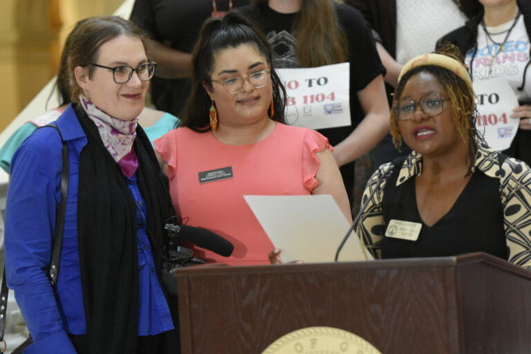 Darlene Wager, left, wife of transgender pride flag designer Monica Helms, accepts a resolution honoring Helms. Ross Williams/Georgia Recorder