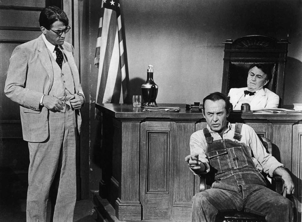 Gregory Peck as Atticus Finch questions a witness (Frank Overton) during a courtroom scene in "To Kill A Mockingbird"