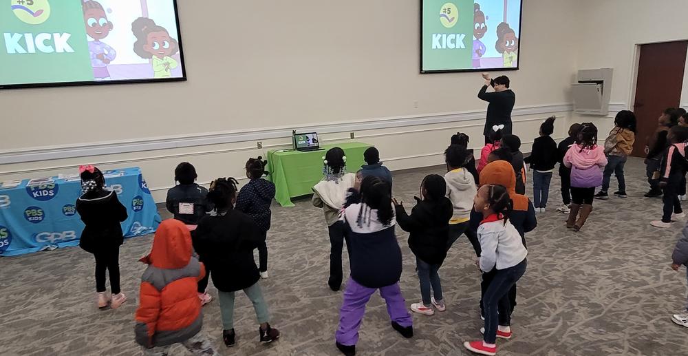 Kids practice the algorithm of the Carrot Cake Dance from "Lyla in the Loop"