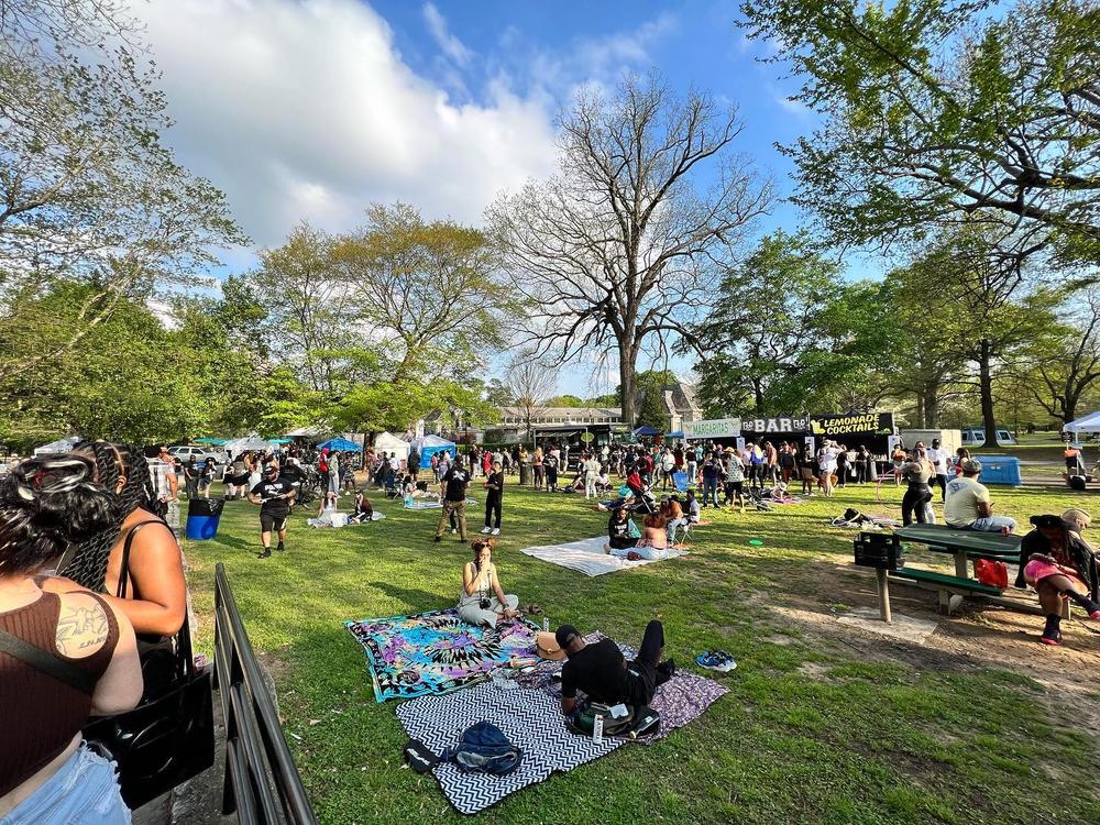 People hanging out at the 404 Day celebration at Piedmont Park in 2023.