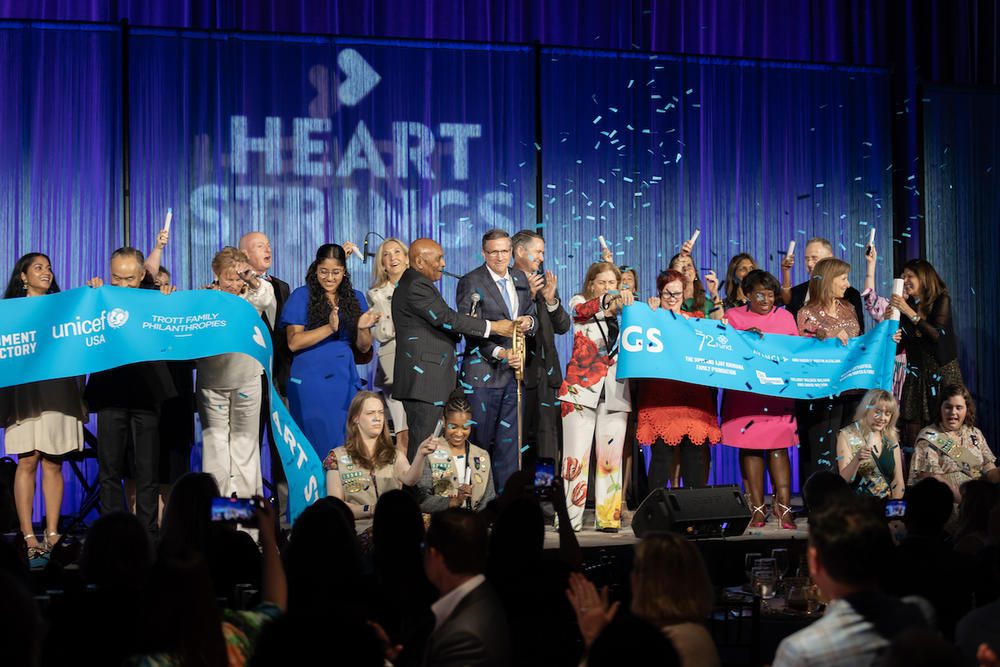 UNICEF executives and supporters celebrate the opening of Heart Strings at Atlanta's Pullman Yards on April 18, 2024.