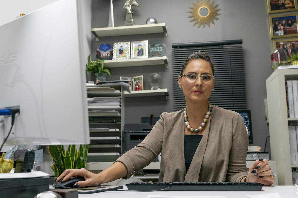 Dorota Mani sits at her desk in her Jersey City, N.J.