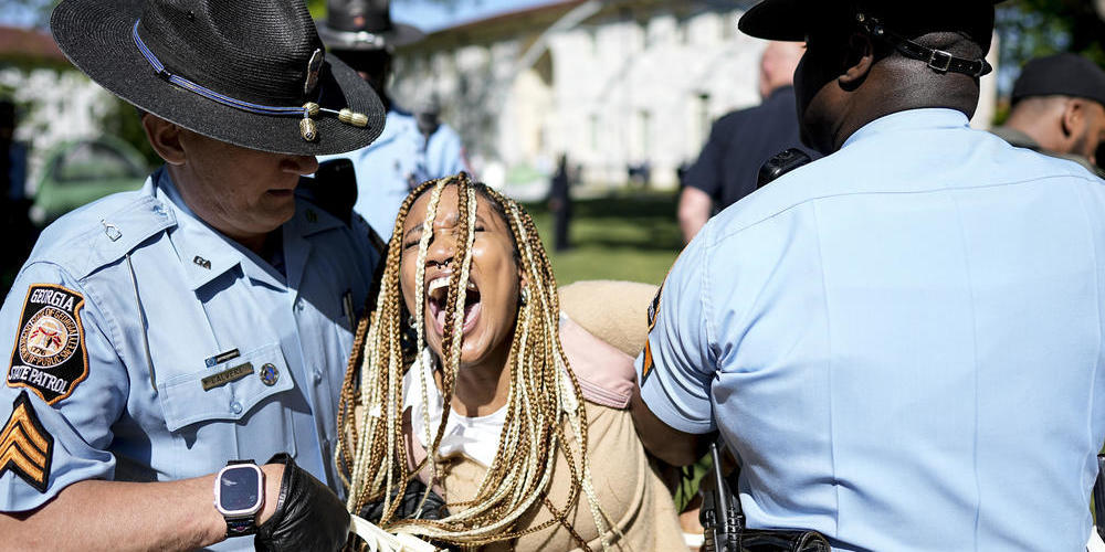 Georgia State Patrol officers detain a demonstrator on the campus of Emory University in Atlanta during a pro-Palestinian demonstration on Thursday, April 25, 2024.
