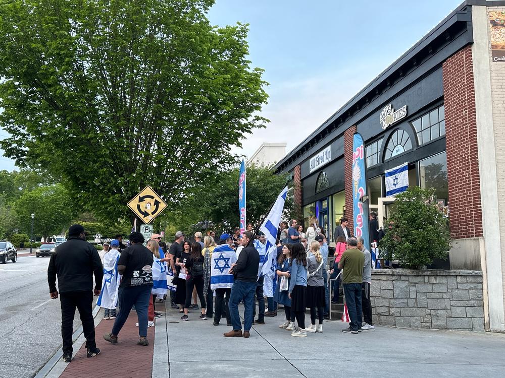 About 50 Jewish and Israeli community members gathered in front of Ali’s Cookies in Emory Village on April 25.