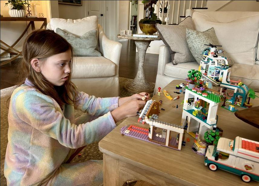 Jansen Jones plays with Legos in her family home in Buckhead.