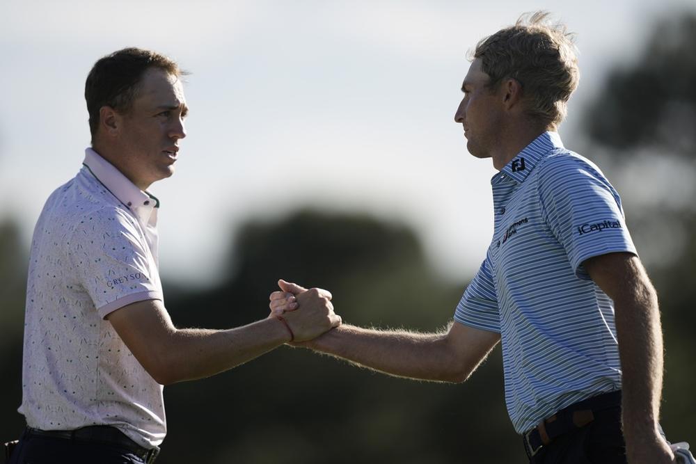 Justin Thomas and Will Zalatoris shake hands after the first round at the Masters golf tournament at Augusta National Golf Club Thursday, April 11, 2024, in Augusta, Ga. 