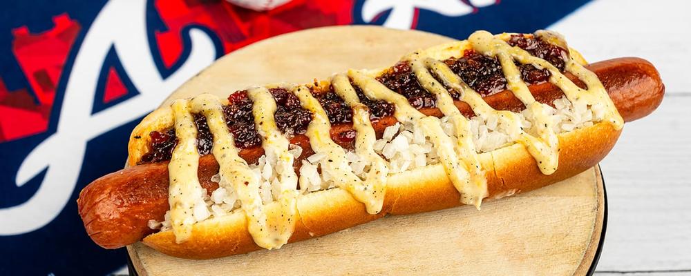 Truist Park unveils 'The Perimeter Dog': It's a foot-long, half-pound hot dog topped with sweet bacon jam, spicy sport peppers, diced Vidalia onions and lemon-pepper Dijonnaise sauce. Available at 1871 Grill near section 141.