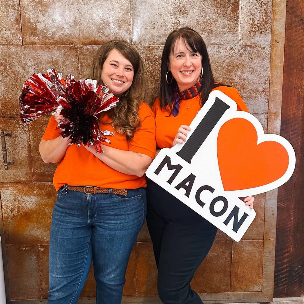Emily Hopkins, left, and Trish Whitley smile for a photo as part of downtown Macon’s Hype Team. Downtown Macon’s Hype Team is a group of ambassadors and social media influencers who are cheerleaders for downtown area.