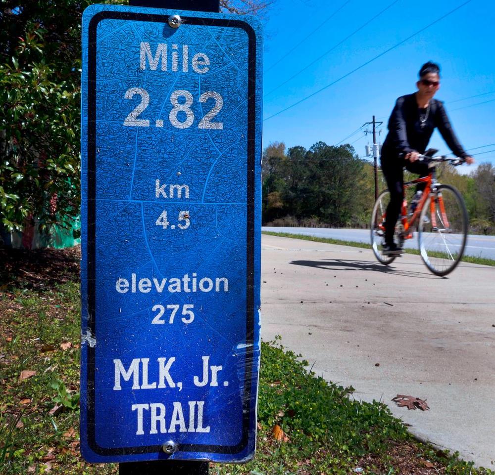 A bicyclist rides along a portion of the Dr. Martin Luther King, Jr. Outdoor Learning Trail in Columbus, Georgia.