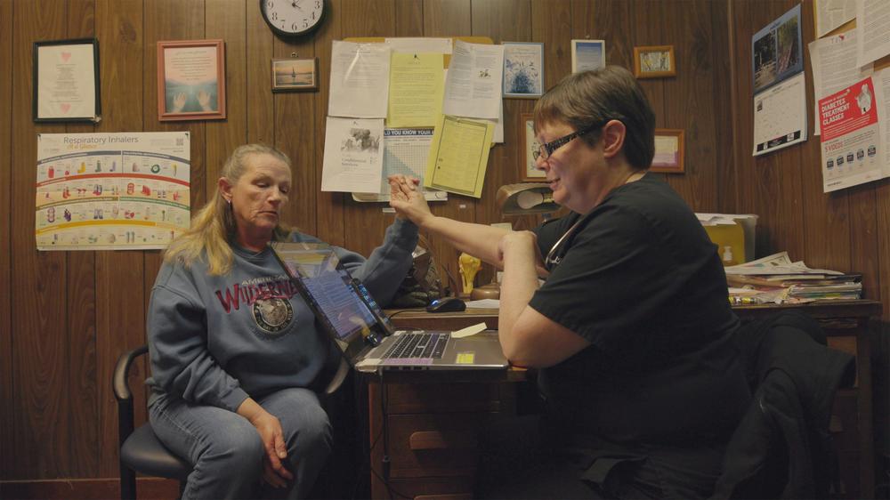 Doctor Karen Kinsell (right) meets with a patient in the film 'The Only Doctor'.