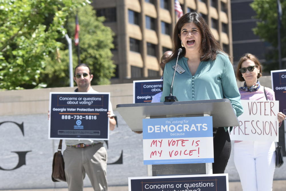 Rep. Saira Draper speaks at a press conference raising concerns about potential mass voter challenges.