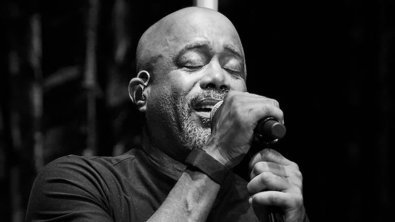 Darius Rucker singing into a microphone