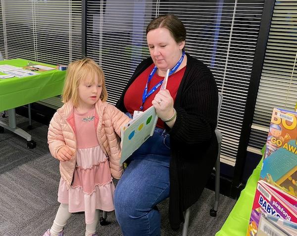 Meagan Stone from Fulton County Library System brought books for families to read and share.