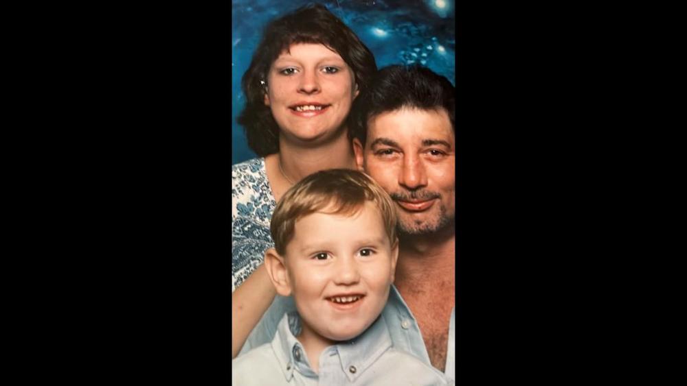 Albert Kenneth Knight III, center, with his mother and late father, Albert Kenneth Knight Jr.