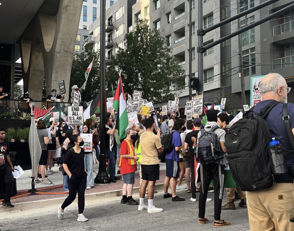 Protesters gathered on 10th Street in the early evening before the presidential debate in Atlanta on June 27, 2024.