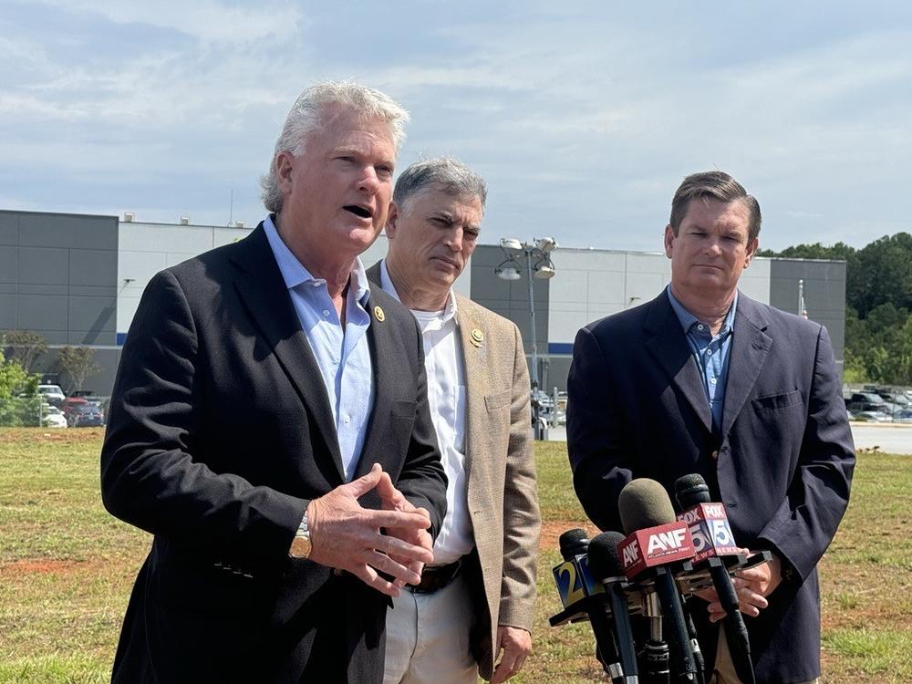 U.S. Reps. Mike Collins (left), Andrew Clyde (center) and Austin Scott (right) outside of the Palmetto USPS facility. 