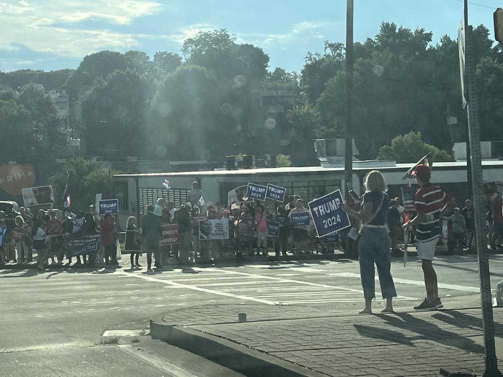 People begin lining the streets near the debate site at approximately 7 p.m. in Midtown Atlanta on June 27, 2024.