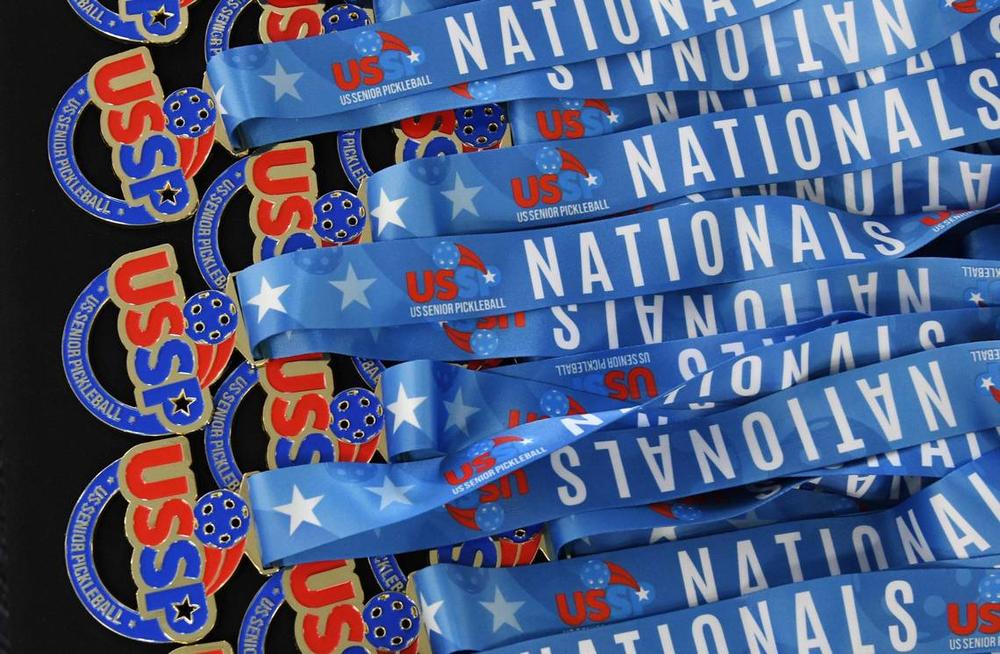 Medals from the United States Senior Pickleball Indoor National Championships rest on a table on Saturday, July 13, 2024, at Rhythm & Rally Sports & Events in Macon, Georgia. United States Senior Pickleball hosted its inaugural indoor national championships this year, spanning three days and bringing hundreds of seniors to compete in Macon from across the country. Katie Tucker/The Telegraph