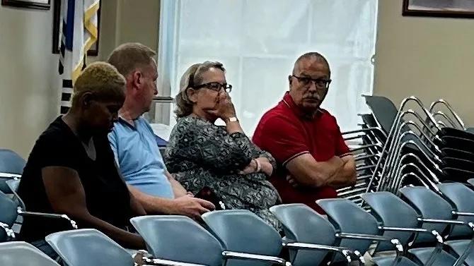 Gary Eason (right), Republican challenger for Liberty County sheriff, listen as the Board of Commissioners discusses Sheriff Will Bowman’s RedSpeed account, Hinesville, April 18, 2024. Eason called for an investigation into Bowman’s donations from the fund to local youth sports teams and the Bradwell Institute Marching Band. Credit: Robin Kemp/The Current GA