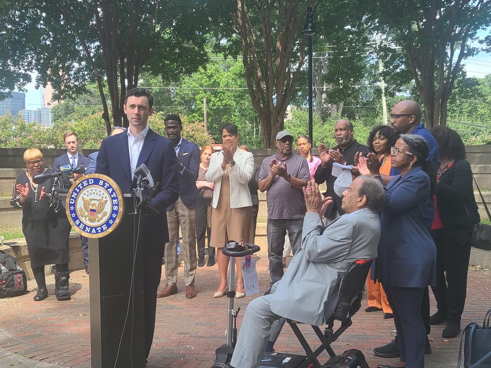 Sen. Jon Ossoff joined other Georgia human rights advocates Aug. 6, 2024, to speak about a new law requiring federal prisons to face regular independent investigations. Amanda Andrew/GPB News