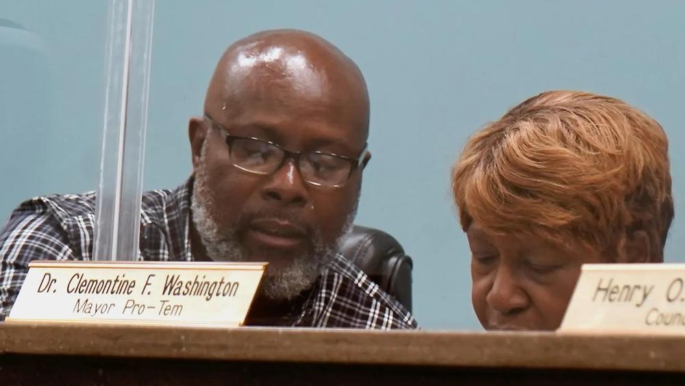 Midway Mayor Levern Clancy (left) and Mayor Pro Tempore Clemontine Washington (right) confer before a special called meeting and work session that were to have addressed issues at the Midway Volunteer Fire Department, July 29, 2024. The meetings were canceled due to lack of a quorum.