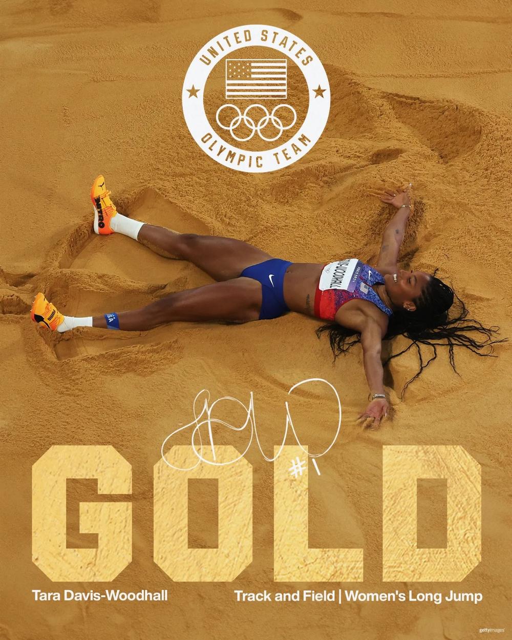  Tara Davis-Woodhall makes a sand angel after winning gold in the long jump. (Credit: @TeamUSA on X)
