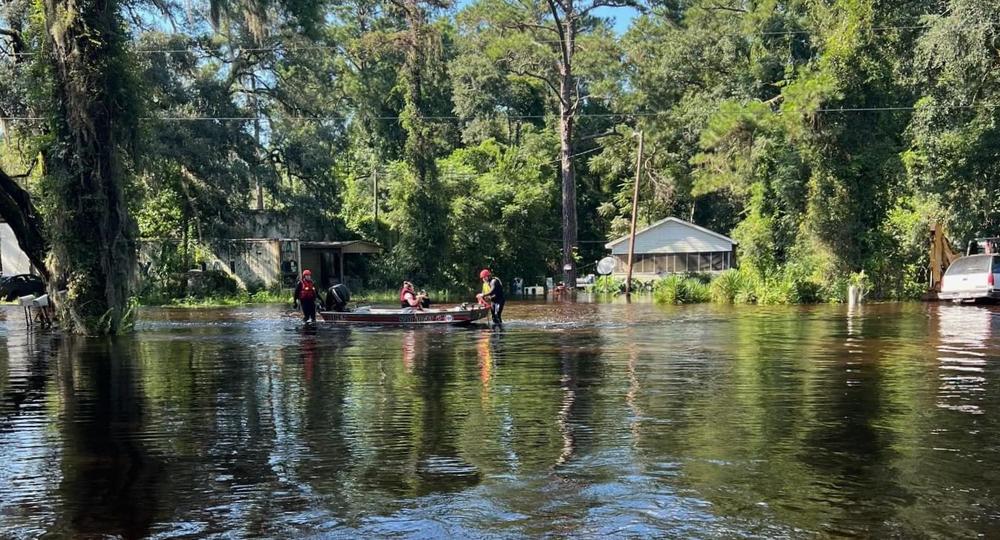 Bryan County resident Christy Mingledorff and her two children had to evacuate their house, seen at right, in the Morgan's Bridge neighborhood after it flooded on Thursday, Aug. 8, 2024.