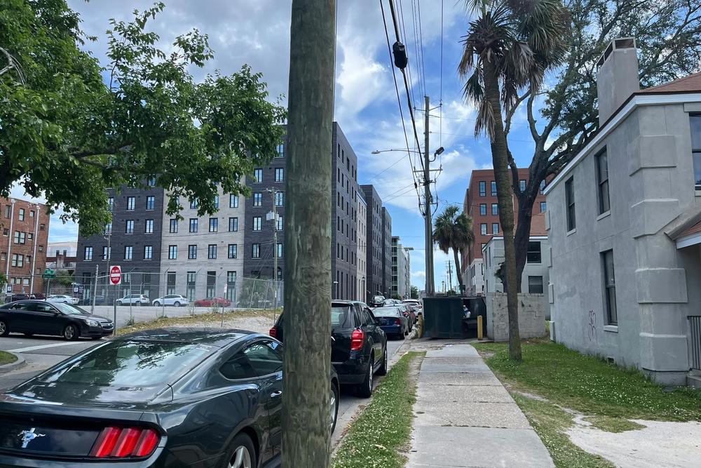 Upscale condos and hotels surround Yamacraw Village, just a few blocks from Savannah’s tourist waterfront. (Renuka Rayasam/KFF Health News)
