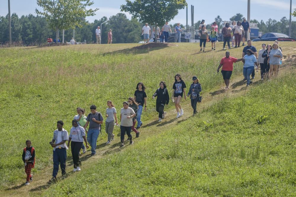 Students and parents file out of the campus of Apalachee HIgh School in Winder, Ga., after being released from lockdown following the school shooting there Sept. 4, 2024.