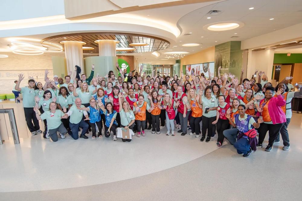 Staff and volunteers cheer on patients as they arrive at Children’s Healthcare of Atlanta Arthur M. Blank Hospital. (Courtesy of Children’s Healthcare)