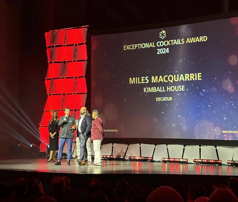 Kimball House partner and beverage director Miles Macquarrie accepting Michelin’s award for Exceptional Cocktails. (Photo by Beth McKibben)