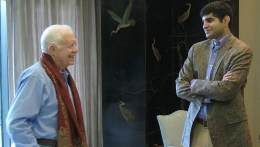 Kabir Sehgal (right) meets with Jimmy Carter at the Carter Center in this undated photo.