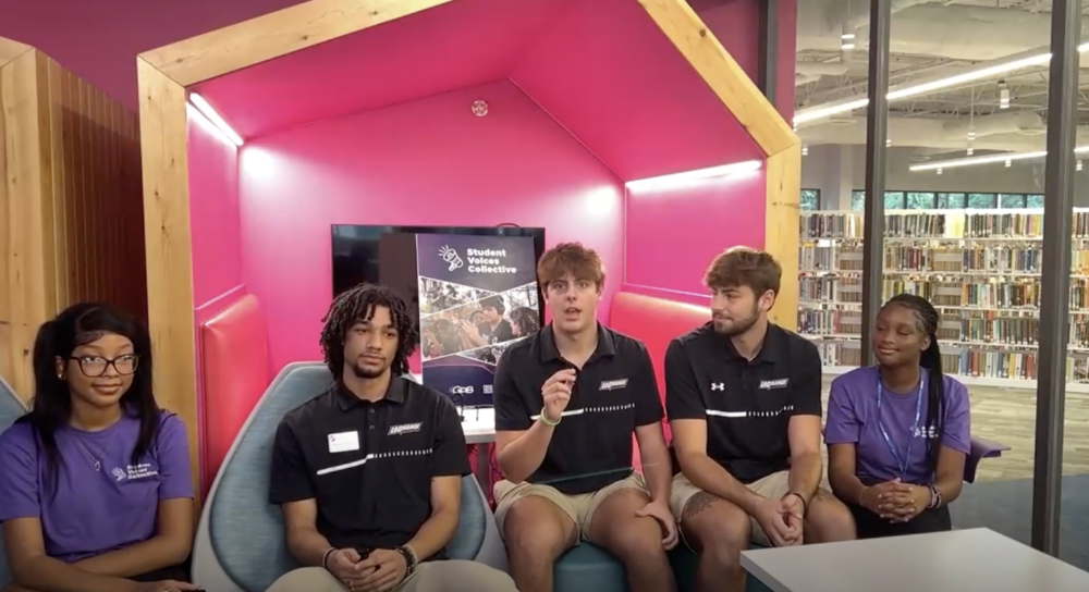 LaGrange High School students TyCianna Rome (left) and Chariya Johnson (right) interview LaGrange College men's basketball players (left to right) Tayshawn Pendleton, Ethan Richerzhagen and Colin Slatton in September 2024.