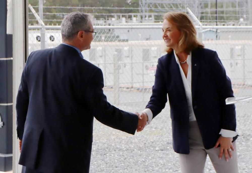 Tim Echols, Public Service Commissioner, and CEO/President of Georgia Power Kim Greene shake hands at the opening of the Mossy Branch Energy Facility in Talbot County. 11/07/2024 Kala Hunter khunter@ledger-enquirer.com
