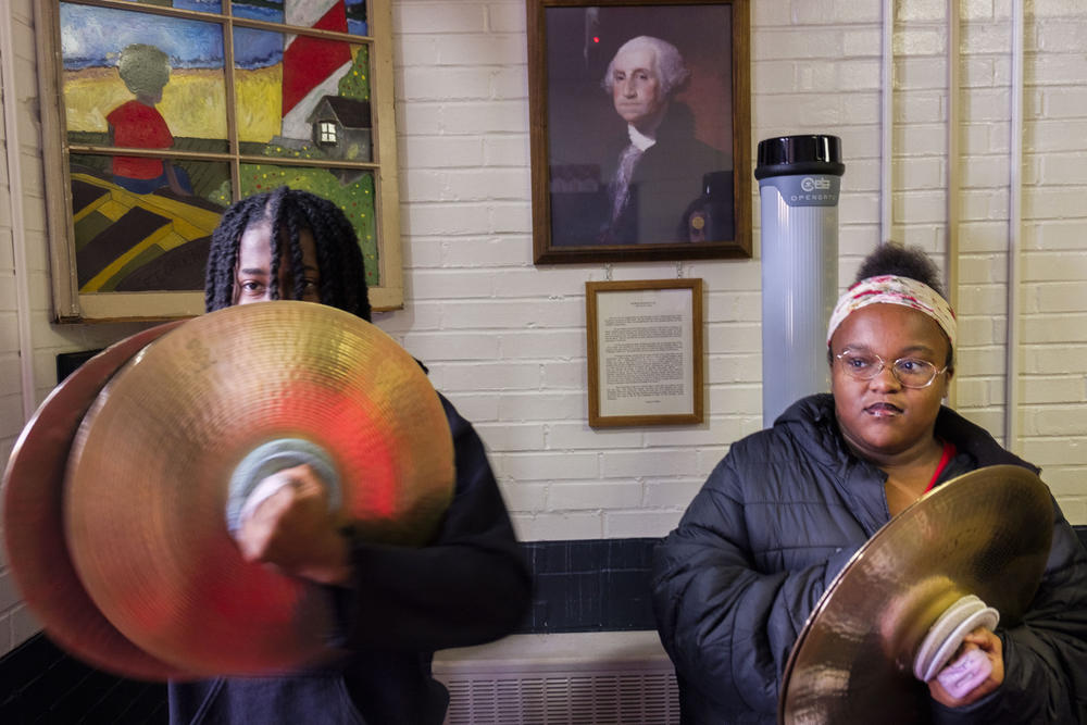 Members of the Northeast High School drum line in the lobby of Bernd Elementary School. 